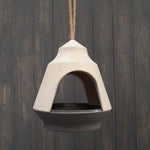 The Earthy Natural/Anthracite Bamboo 2-tone Hanging Bird Feeder is vegan-friendly, crafted from bamboo with a sleek design and an anthracite dish. It hangs elegantly from a rope against rustic wooden planks.