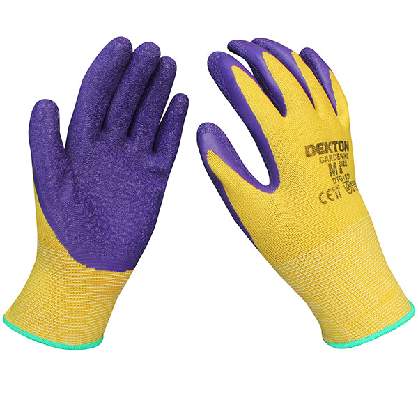 Two Dekton Touch Grip Latex Coated Gardening Gloves 8/Medium are displayed against a white background. The gloves are yellow with purple, textured, rubberized palms and fingers for enhanced grip. The cuffs of the gloves are edged with a light blue trim, and the brand name "DEKTON" is printed on the back.