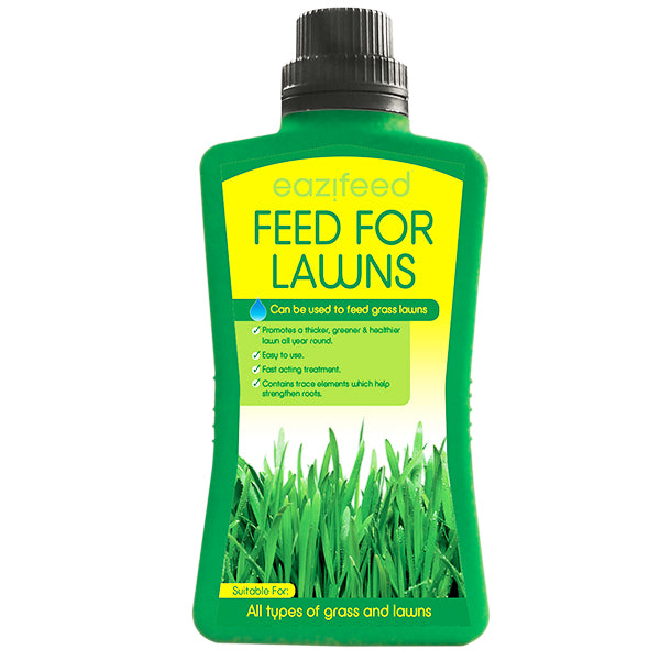 A 500ml green bottle of "Eazifeed Feed For Lawns" features a black cap and a label that highlights its benefits, such as promoting greener, healthier grass with a fast-acting lawn formula that strengthens roots. It is suitable for all types of grass and lawns.