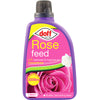 A purple bottle of Doff Rose Feed Concentrate 1L with a black cap, featuring the label "Rose Feed with Seaweed & Magnesium Concentrate," displays an image of a pink rose and notes that it makes up to 300 liters of feed. This enriched blend, containing essential nutrients, comes in a 1-liter bottle.