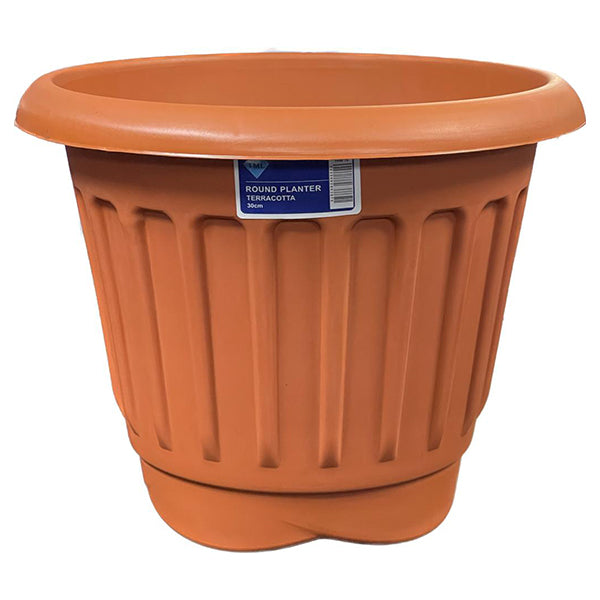 A large, round, terracotta-colored plastic planter featuring vertical ridges and a small label near the top that reads "Round Ribbed Plastic Planter Terracotta 30cm," this weather-resistant plant pot is perfect for your outdoor garden space.