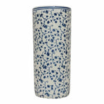 The Jane Blue & White Floral Umbrella Stand is a tall, cylindrical ceramic piece with a white base and intricate hand-painted blue floral and vine patterns—ideal for chic interiors or as a stylish umbrella holder.