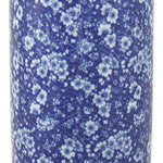 The Umbrella Stand features a vintage blue and white daisies design on a tall, cylindrical ceramic body.