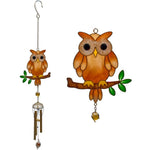 The Brown Owl Windchime features a glittery owl perched on a branch with green leaves, metal tubes hanging below. This charming decorative piece is perfect for adding character to your garden.