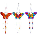 A set of 12 vibrant butterfly suncatchers featuring colorful glass wings and dangling beads, showcased in red, multicolored, and rainbow themes, elegantly hanging against a white background.