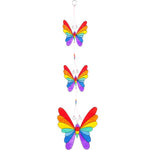 The "String Of Butterflies" features three rainbow-colored butterflies arranged vertically, each one diminishing in size as you move downward. This enchanting mobile, crafted with ethically sourced materials, connects the vibrant butterflies with strings to create a captivating sun catcher display.