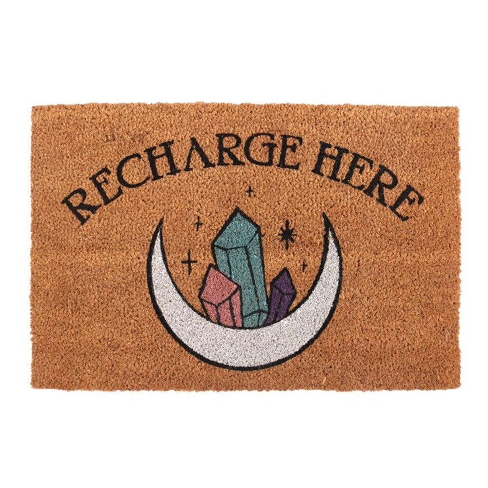 The Natural Recharge Here Crystal Doormat showcases the words "Recharge Here" in black on a brown backdrop. A mystical moon cradles vibrant crystals among scattered stars, adding both energy and style to any entrance.