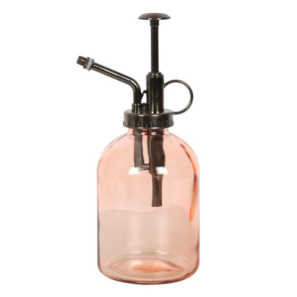 The Pink Minimalist Glass Plant Mister is a chic home accessory with a metallic pump and nozzle, featuring a circular handle on top and a sleek design—perfect for caring for your indoor garden.