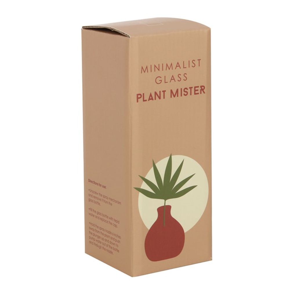 A cardboard box labeled "Pink Minimalist Glass Plant Mister" in red, ideal for your indoor garden. The box includes an illustration of a round red vase with green leaves against a beige circle. Instructions for use are printed on the side, making it an essential home accessory.