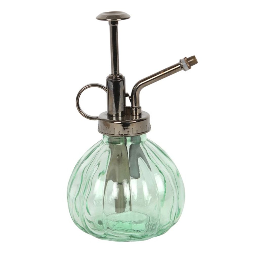 Introducing the Green Botanical Plant Mister, a stylish vintage-inspired plant care accessory. It features a ribbed round body made from green glass and is beautifully paired with a shiny metal pump complete with a small spout.