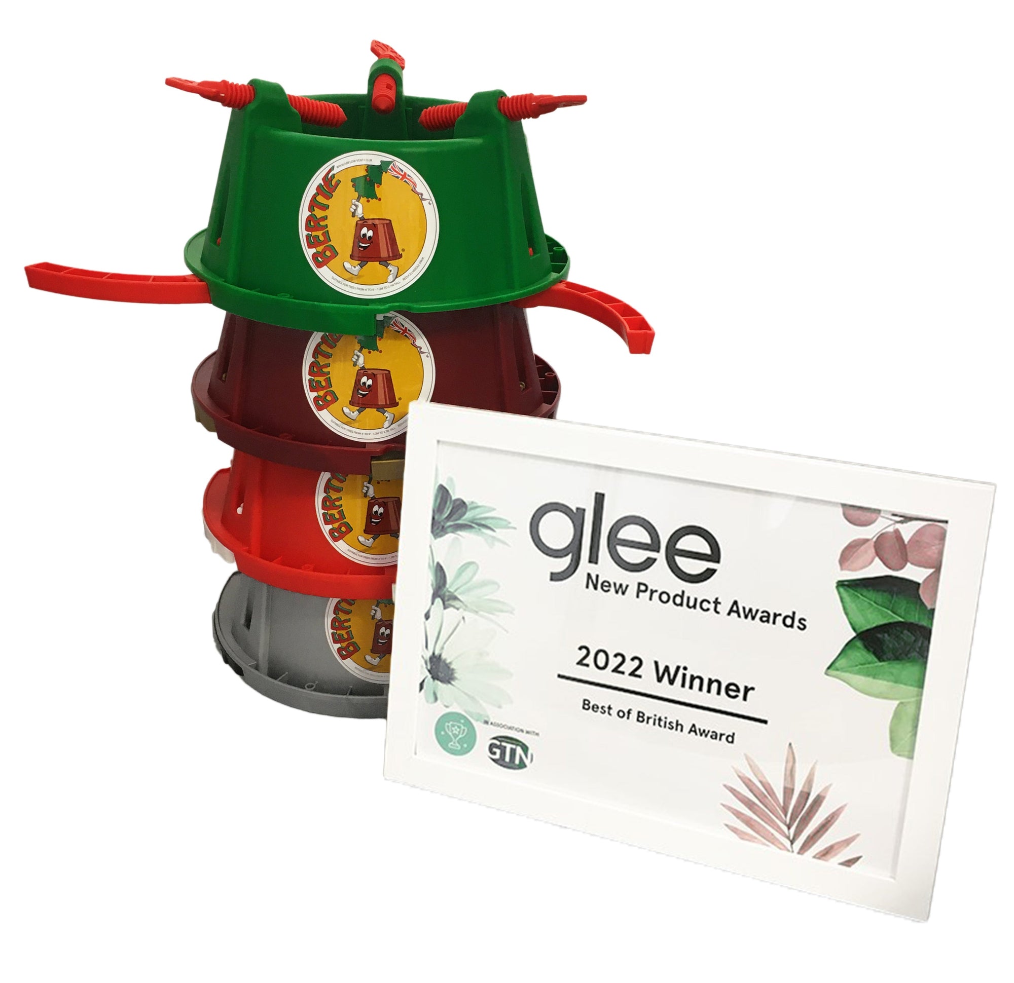 Three stacked plastic buckets in green, red, and gray are next to a framed "glee New Product Awards 2022 Winner" certificate for the Best of British Award. Perfect for holiday decorating or as a sturdy support for your Bertie Christmas Tree Stand.