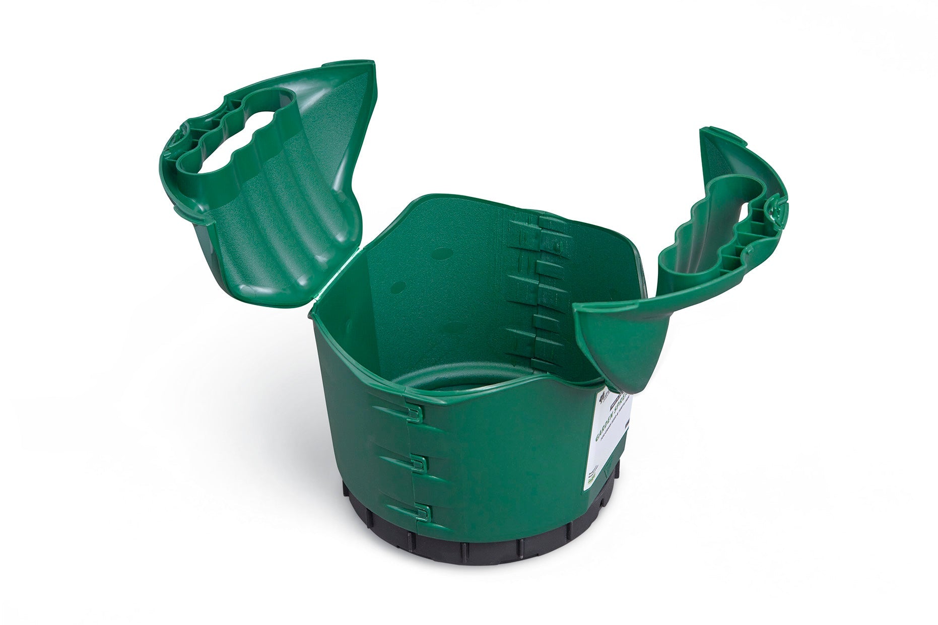 The Multipurpose Garden Spreader, Twist & Shake Action, is a green plastic tool featuring adjustable sides and interlocking mechanisms. It comes with two large handles for easy carrying and its flexible structure demonstrated in an opened state reveals its expandable nature to accommodate various root sizes. Its multiple applications make it a versatile addition to any garden setup.
