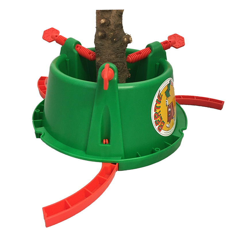 The Bertie Christmas Tree Stand is a green plastic stand with red screws and levers for securing the trunk. It offers sturdy support and features a festive sticker on the side with a graphic tree and the text "Weber Tree," making it perfect for holiday decorating.