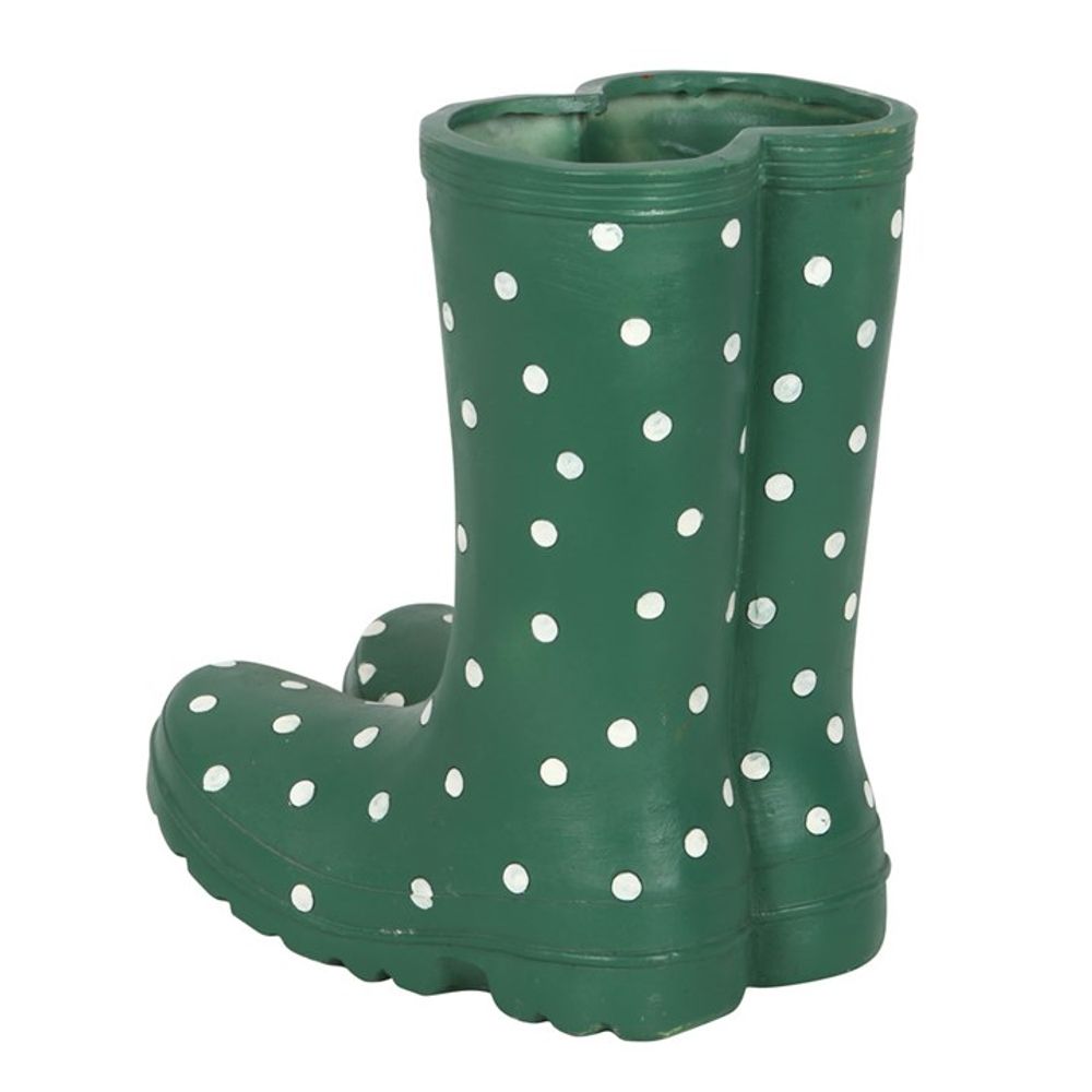 A Dark Green Welly Boot Planter, reminiscent of charming garden decor, stands upright against a plain white background.