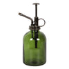 Introducing the Green Minimalist Glass Plant Mister, an ideal addition to your indoor garden. With a moss green glass body and a sleek metal pump and spout, this mister features a vintage-style design, complete with a brass-colored nozzle and handle for gentle plant care.