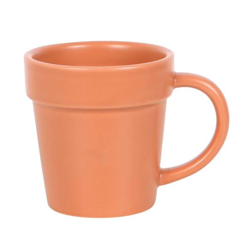 Introducing the Plain Plant Pot Ceramic Mug and Shovel Spoon—a brown ceramic mug with a large handle, showcasing a simple and smooth design, ideal for a garden tea break.
