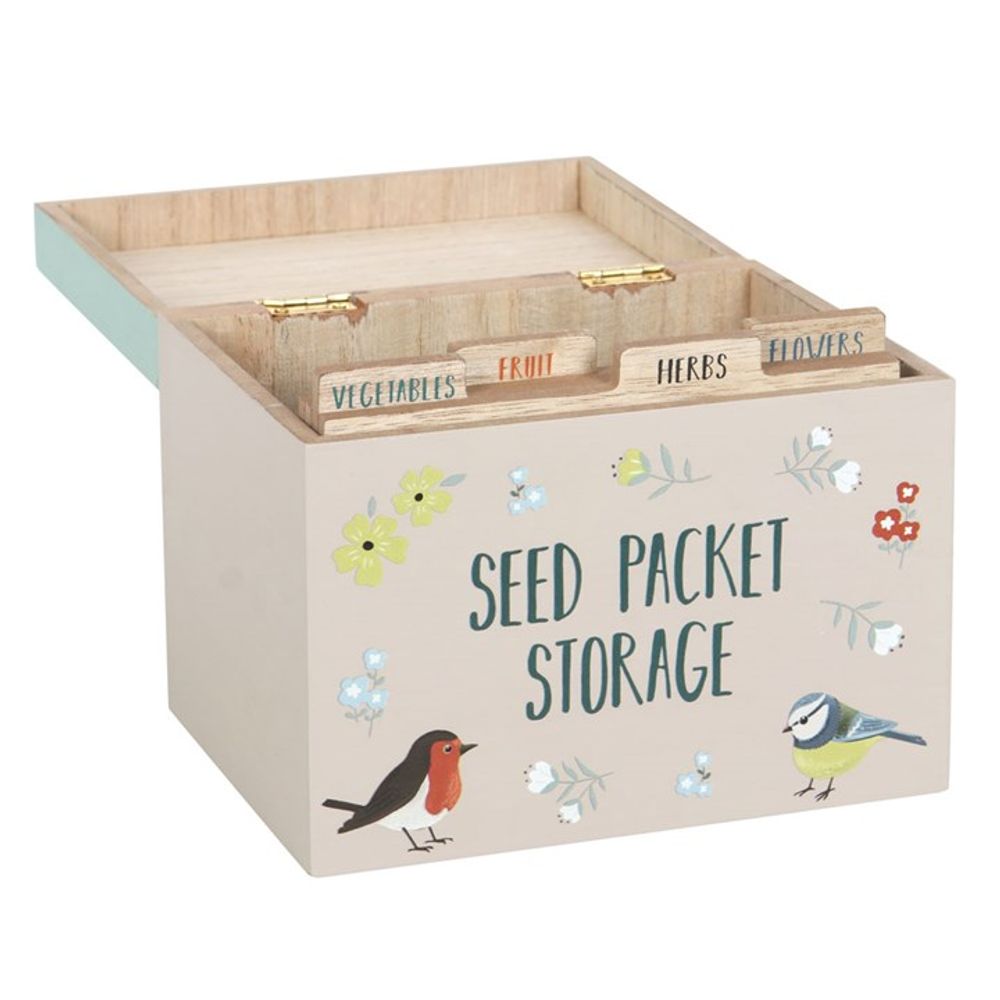 The British Garden Birds Seed Packet Storage Box is a charming wooden storage box with an open lid, ideal for gardeners. It has dividers labeled "Vegetables," "Fruit," "Herbs," and "Flowers," and the front is decorated with a robin, blue tit, and floral designs. Perfect as a gift!.