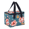 The Bee-utiful Floral Lunch Bag is an insulated square-shaped bag made from recycled plastic. It features a teal background adorned with vibrant floral designs of red, pink, and yellow flowers. The bag is complemented by black handles and a top zipper closure.