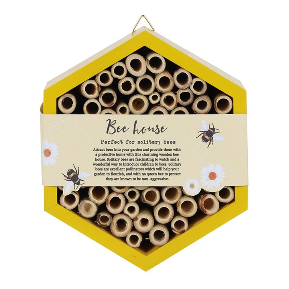 The Wooden Bee House is a hexagonal structure with multiple hollow tubes for solitary bees, featuring a yellow border and a label that reads "Bee house - Perfect for pollinators," adorned with charming bee and flower illustrations—ideal for any garden.