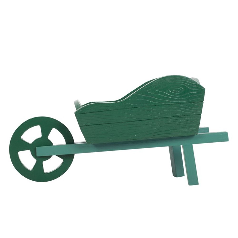 The Green Resin Wheelbarrow Planter, featuring a textured wood-grain finish and single wheel with two sturdy legs, is ideal as a garden accessory or charming planter. Set against a plain white background, it's perfect for enhancing garden displays.