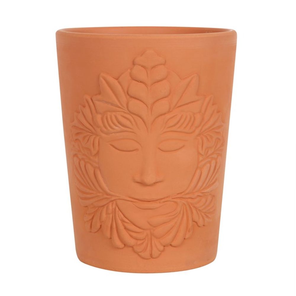 The 16cm Green Goddess Terracotta Plant Pot features an embossed face with stylized leaf motifs, reflecting Mother Earth's serene expression. This natural clay cylindrical planter epitomizes a timeless link to the Green Goddess.
