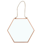 The Large Geometric Mirror, featuring a sizeable hexagonal shape and a slender copper frame with geometric detailing, hangs gracefully from a rope. Displayed against a white background, it highlights its minimalist design while serving as an eye-catching piece of home decor.
