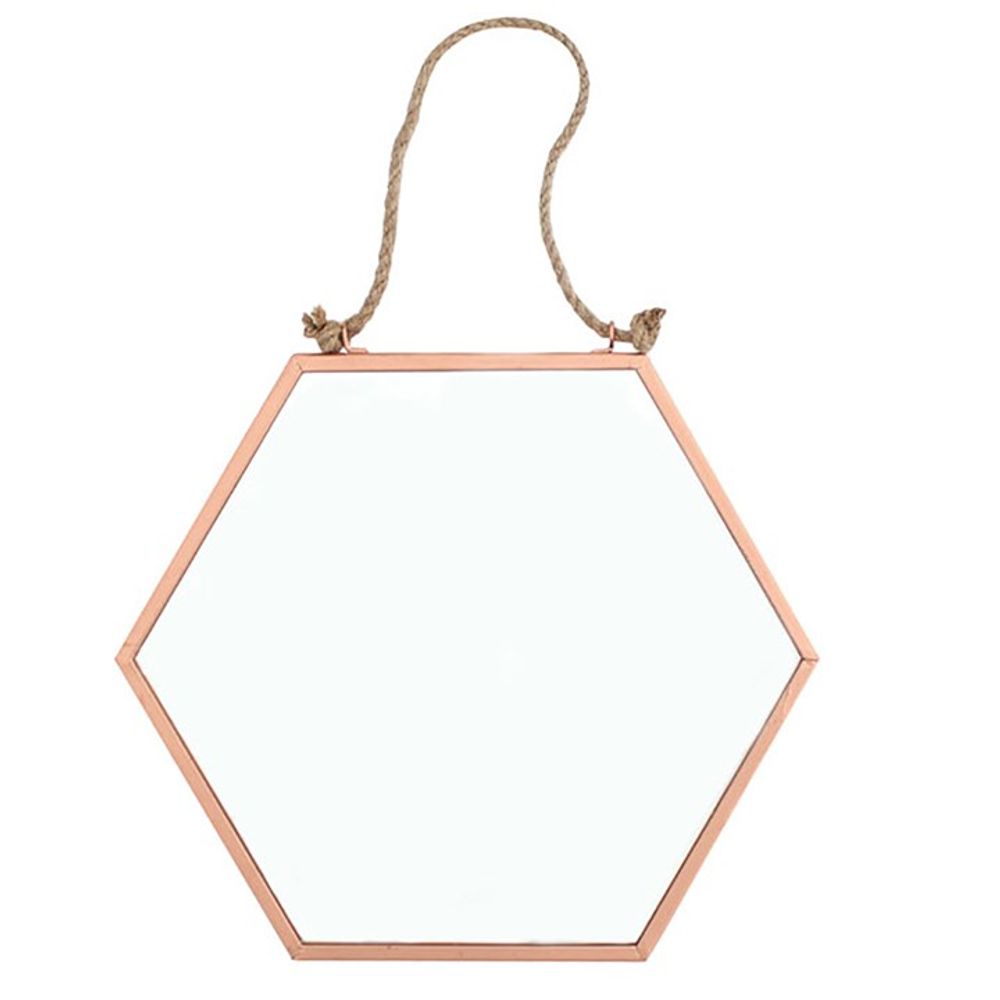 The Small Geometric Mirror, featuring a hexagonal shape with a copper-colored frame, is suspended by a rope knotted at both ends and attached to the top corners. Ideal for modern home decor, it creates a striking contrast against a plain white background and adds style to any space.