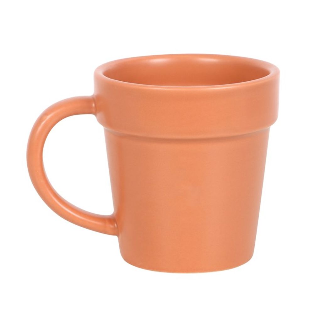 Enjoy your garden tea break with the Plain Plant Pot Ceramic Mug, thoughtfully designed to mimic a terracotta plant pot and equipped with a handle. Enhance your experience by pairing it with our unique mini shovel spoon for an authentic gardening feel as you sip.