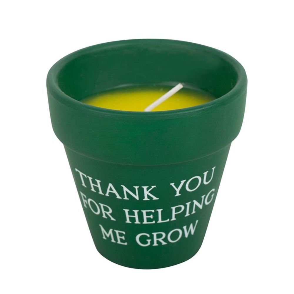 The Thank You for Helping Me Grow Citronella Candle is a charming green ceramic pot-shaped piece featuring "Thank You For Helping Me Grow" in white. With sunny yellow citronella wax and a single wick, it's perfect for adding warmth and gratitude to any outdoor space.