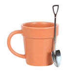 The Plain Plant Pot Ceramic Mug, designed like a terracotta plant pot, comes paired with a mini shovel spoon, making it perfect for a garden tea break.
