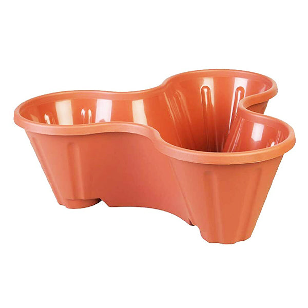 The Strawberry Planter Terracotta Stackable Plant Pot is a durable, terracotta-colored solution for planting strawberries. Featuring a curving, wavy design, this three-tiered plastic pot consists of stackable sections with three individual compartments. Each compartment protrudes outward with fluted edges and boasts a smooth finish.