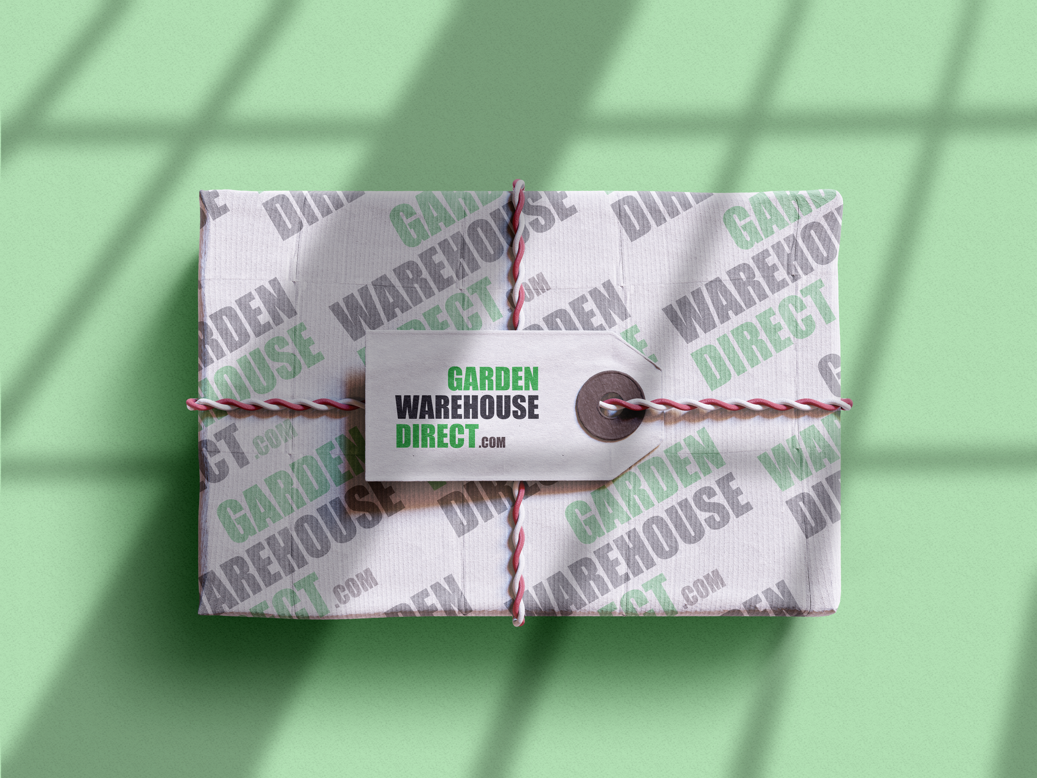 A gift box wrapped in paper featuring the 'Garden Warehouse Direct' logo.