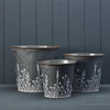 Set of Three Rustic metal planters with Meadow design