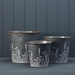 Set of Three Rustic metal planters with Meadow design