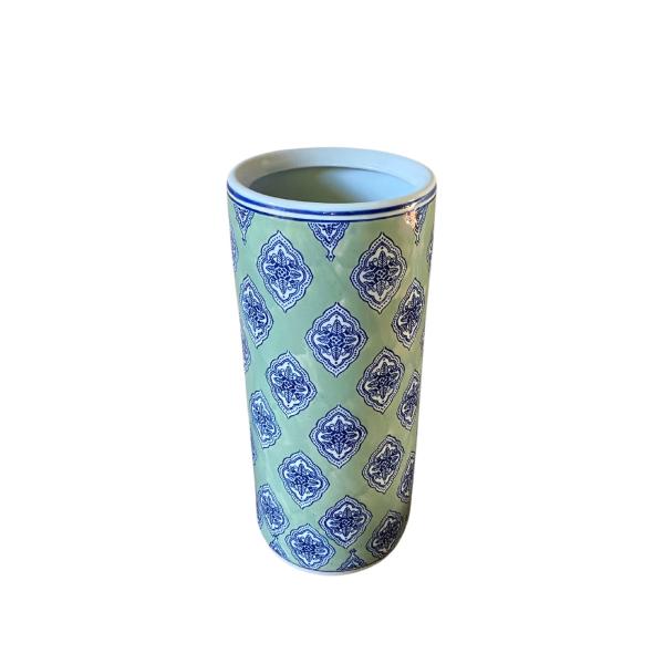 The Green and White Diamond Print Umbrella Stand features a tall ceramic design with a light green background, white rim and interior, and a blue geometric pattern—ideal for keeping your hallway organized.