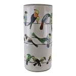 The Ceramic Umbrella Stand, Birds Design, is a tall cylindrical distressed ceramic vase with colorful bird illustrations on black lines over a white background—ideal as a unique vintage stick stand or decorative umbrella stand.
