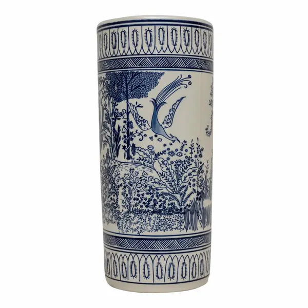 The Monet Blue & White Bountiful Garden Umbrella Stand is a tall, cylindrical ceramic piece with hand-painted blue floral and bird patterns, accented by geometric borders at the top and bottom.