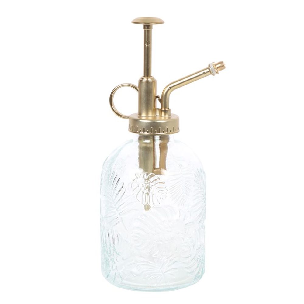 Introducing the Large Leaf Print Glass Plant Mister: a beautifully textured glass plant mister adorned with an embossed floral design. It features a brass-colored metal pump and spout, and the clear bottle is complemented by a circular pump handle, making it ideal for your indoor garden.