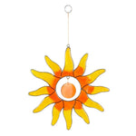 Introducing the Orange Sun Suncatcher: a vibrant window decoration crafted from ethically sourced stained glass, featuring dazzling orange and yellow pieces in a striking sunburst shape. This exquisite piece hangs gracefully from a thin string with a small circular loop at the top, casting radiant hues throughout any space.