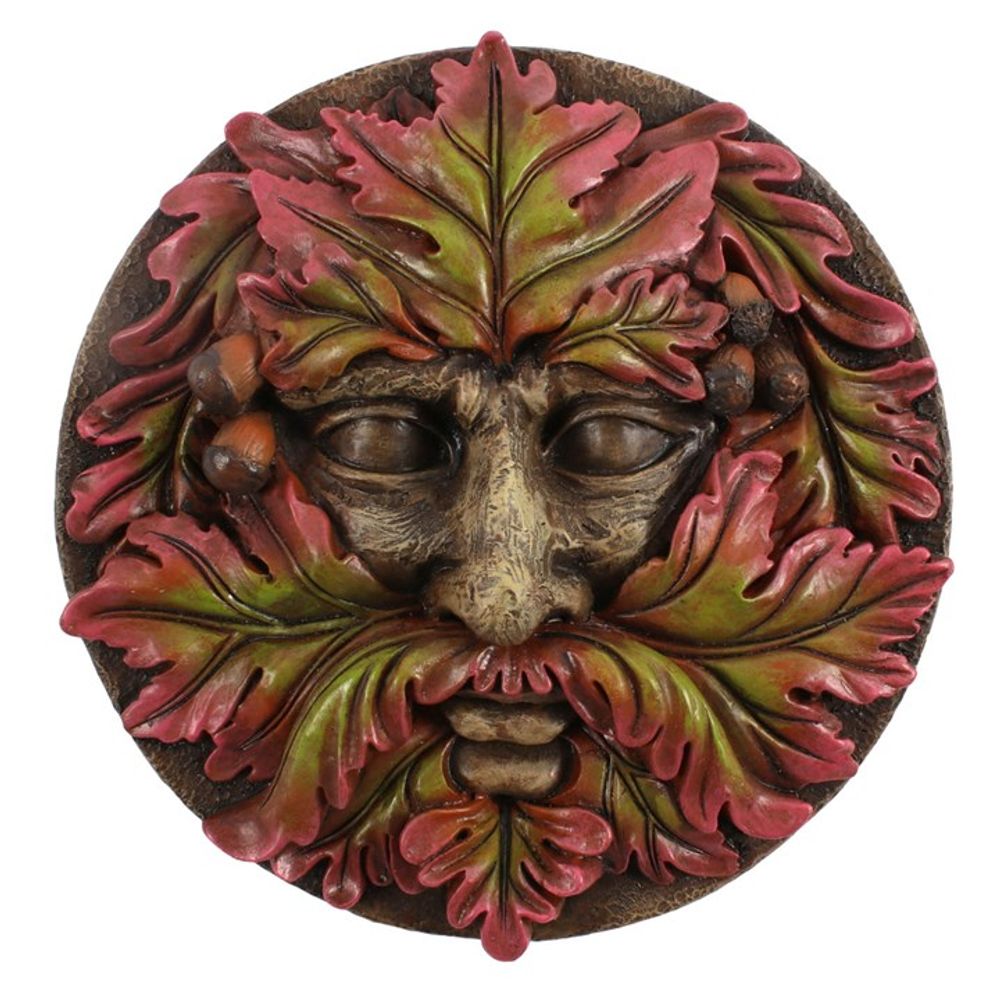 The Green Man Round Face Plaque features a circular, intricate design with a face created from interwoven oak leaves in vibrant red and green colors, accented with acorns. Its earthy theme captures a nature-inspired, mythical look.