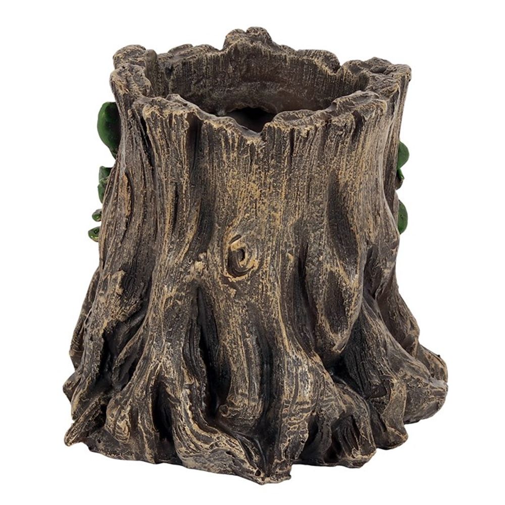 A pencil holder styled like a tree stump, ideal for adding garden vibes to your space. Its bark-like texture has detailed grooves and ridges, with small green leaves on the sides, capturing the charm of The Green Goddess Plant Pot.