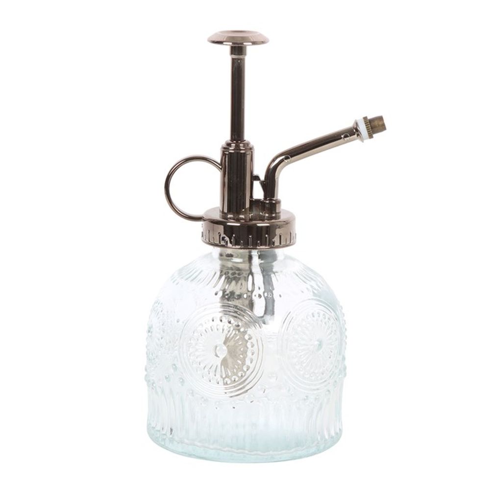 The Small Patterned Glass Plant Mister is ideal for your indoor garden, featuring a clear, circular-embossed patterned body with a metallic pump and nozzle, combining elegance and functionality seamlessly.