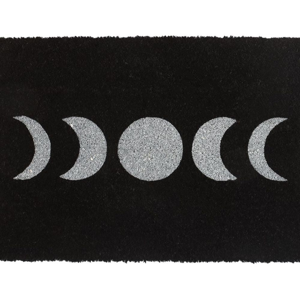 The Black Moon Phase Doormat features a white illustration of the moon's phases, highlighting five key stages: waning crescent, third quarter, full moon, first quarter, and waxing crescent. This arrangement adds a mystical touch to your entryway.