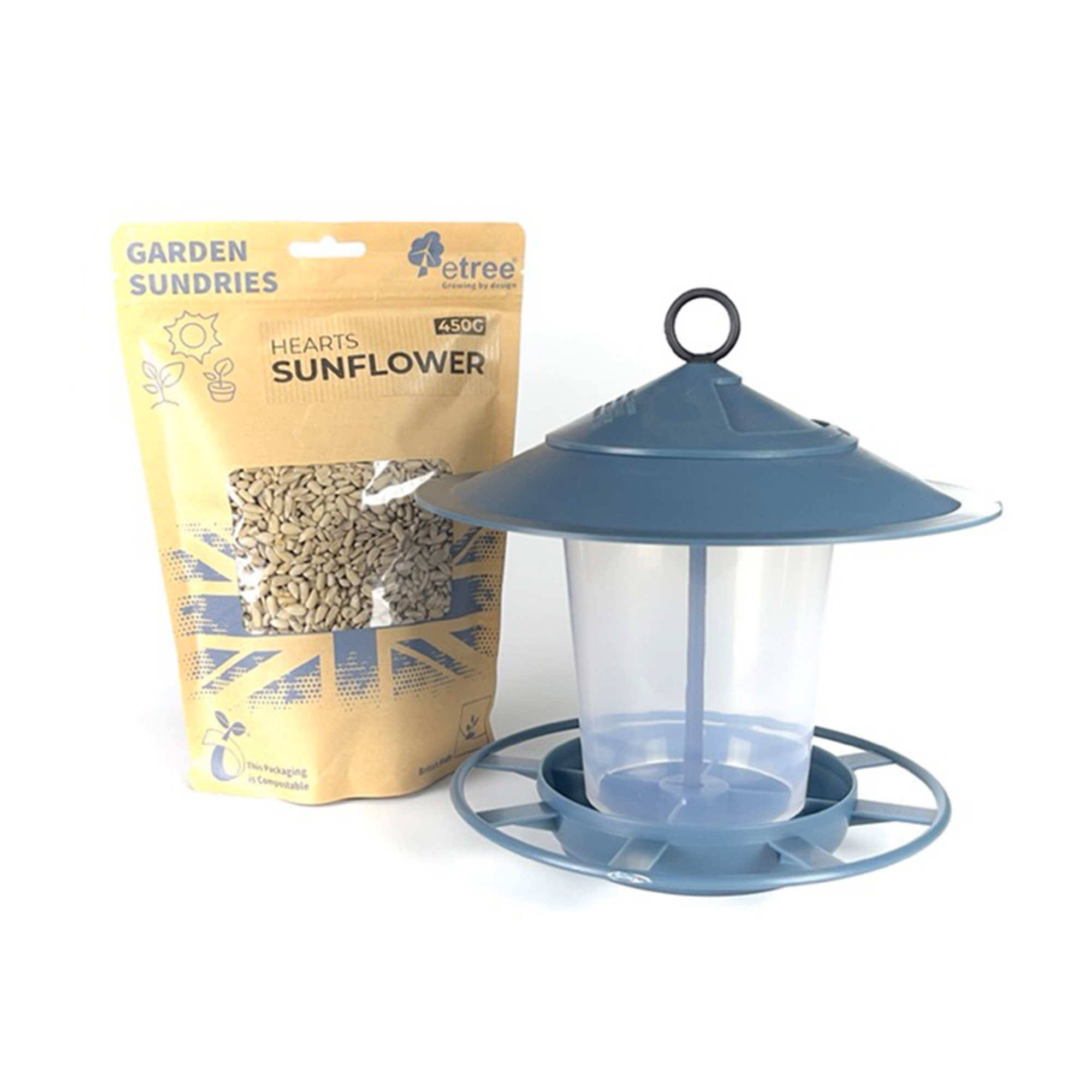 A Midnight Teal Blue plastic bird feeder with a hanging hook sits next to a packet of Sunflower Hearts wild bird seed labeled "Garden Sundries, 450g, Hearts Sunflower." The circular base and clear container make it easy to clean. The green and beige packaging completes this perfect Pre Filled Hanging Lantern Bird Feeder Gift Set & Sunflower Hearts Wild Bird Seed (450g).