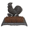 The Cast Iron Garden Boot Brush with a cockerel design features stiff natural fibre bristles on a rectangular base. Ornate detailing and the cast iron rooster add an elegant touch while efficiently cleaning shoe soles.
