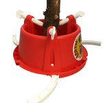 The Bertie Christmas Tree Stand, made of bright red plastic, securely holds the trunk with four white support arms. It includes adjustable white straps for sturdy support and features a colorful decorative sticker on the side. Ideal for efficient holiday decorating, it stands out beautifully against its white background.