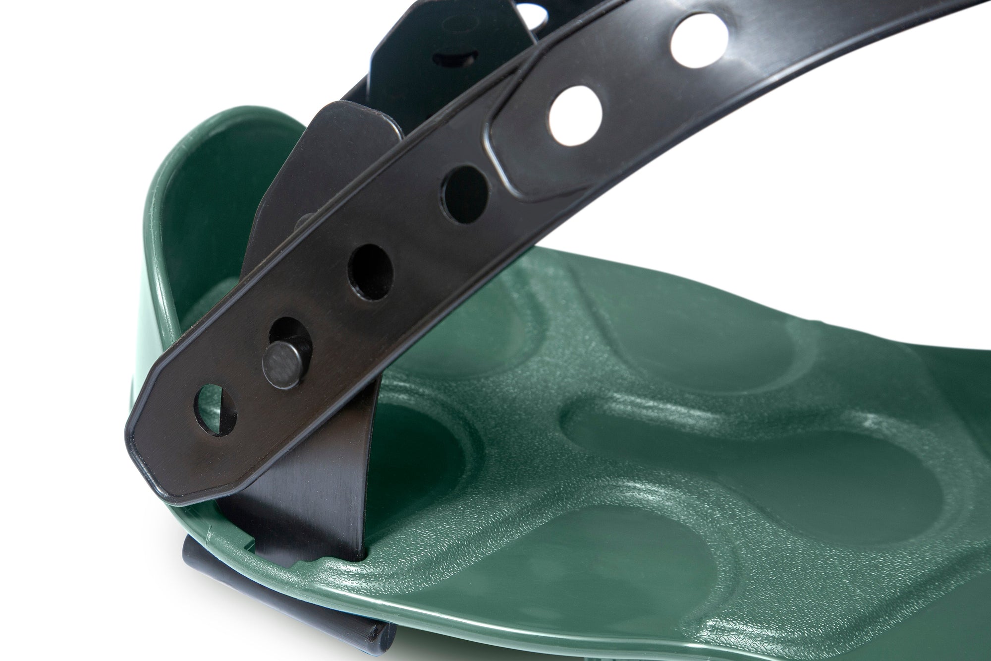 Close-up of a green ProSpike Lawn Aerator Shoe featuring an enhanced strap design. The shoe has a textured, cushioned surface, and the plastic strap includes multiple holes for size adjustment, secured to the shoe with a black plastic bracket.