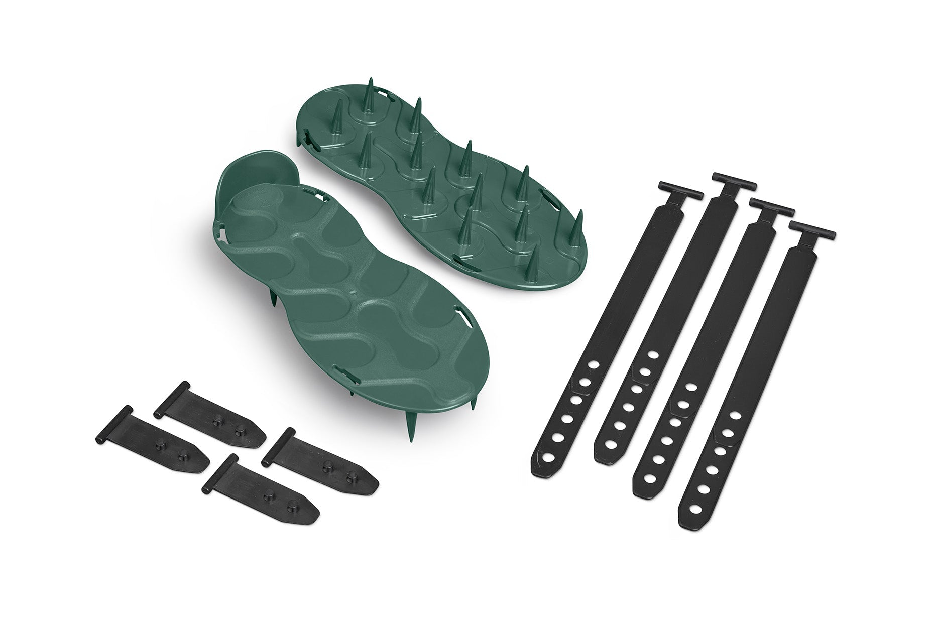 A disassembled pair of ProSpike Lawn Aerator Shoes with dark green soles and black plastic straps. The sandals feature multiple cross-shaped spikes on the underside. The set includes two sandals, four adjustable straps with holes, and four T-shaped fasteners.