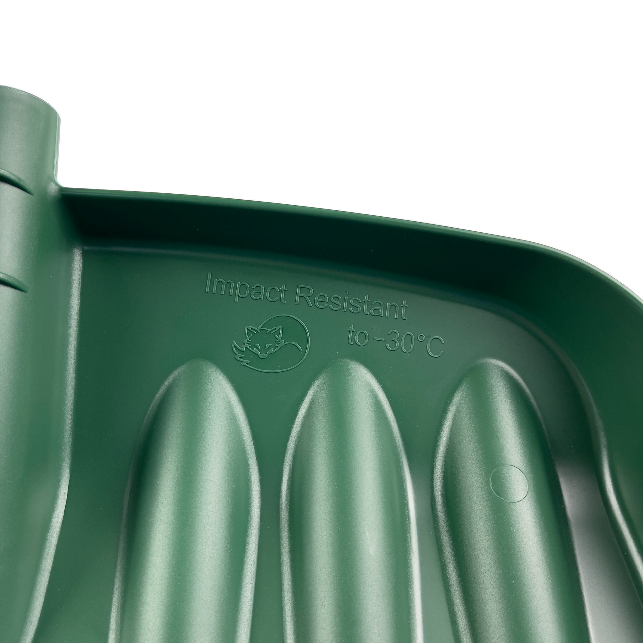 Close-up image showcasing a detailed view of the inner surface of the green plastic Snow & Garden Shovel Blade Heavy Duty Impact Resistant. The text on this impact-resistant shovel reads "Impact Resistant to -30°C," accompanied by a small icon of an evergreen tree. This durable shovel features ribbed sections and a smooth, curved design.