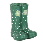 Introducing the Dark Green Welly Boot Planter, featuring polka dots and 'Love Grows Here' written on it, perfect for adding charm to your garden decor.